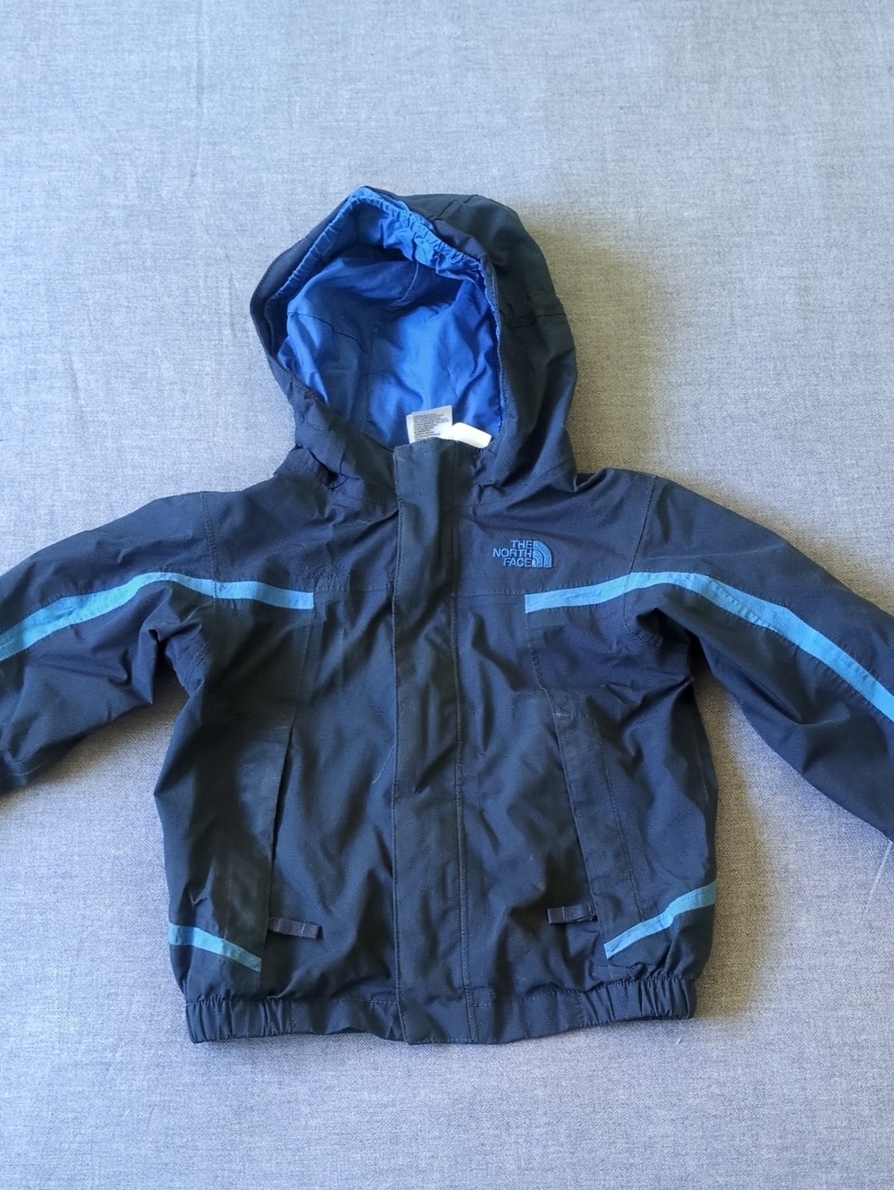 The North Face Black Jacket with Blue Accents - Kids Hooded Raincoat